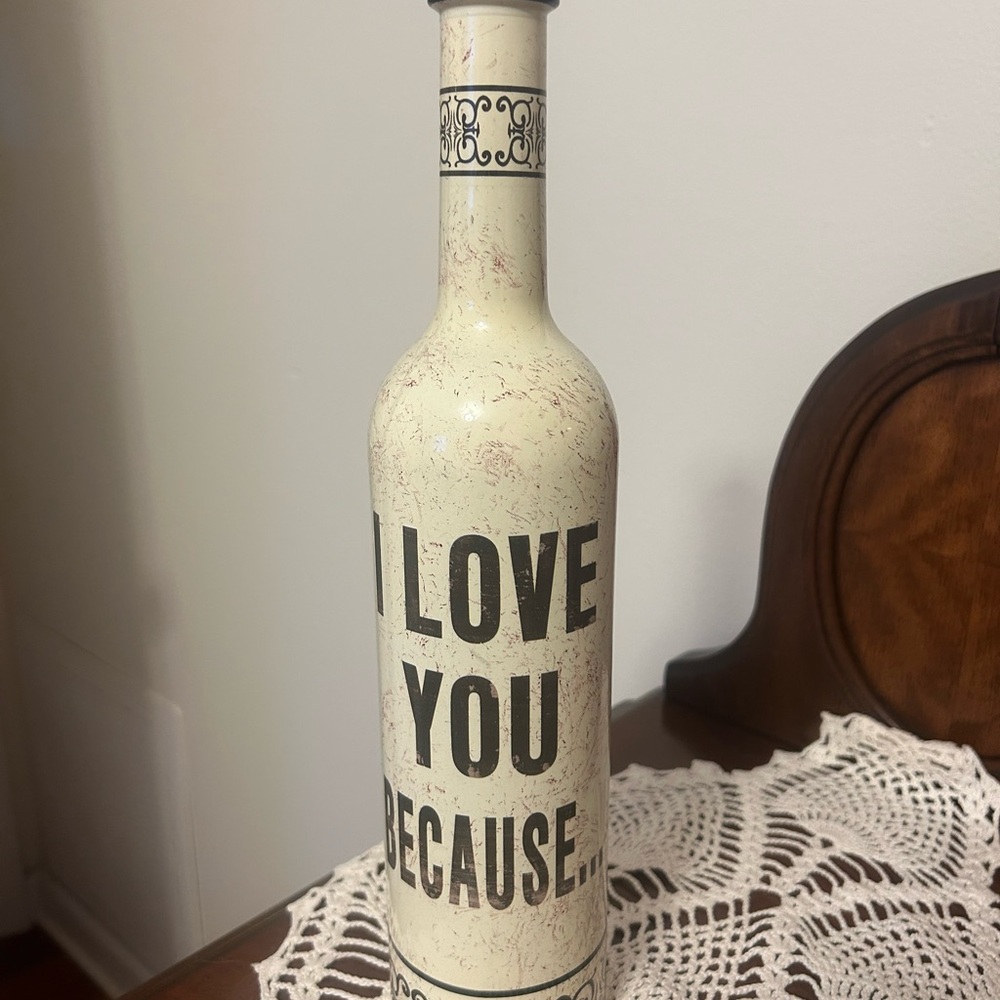 Decorative Cream Bottle with Black Text